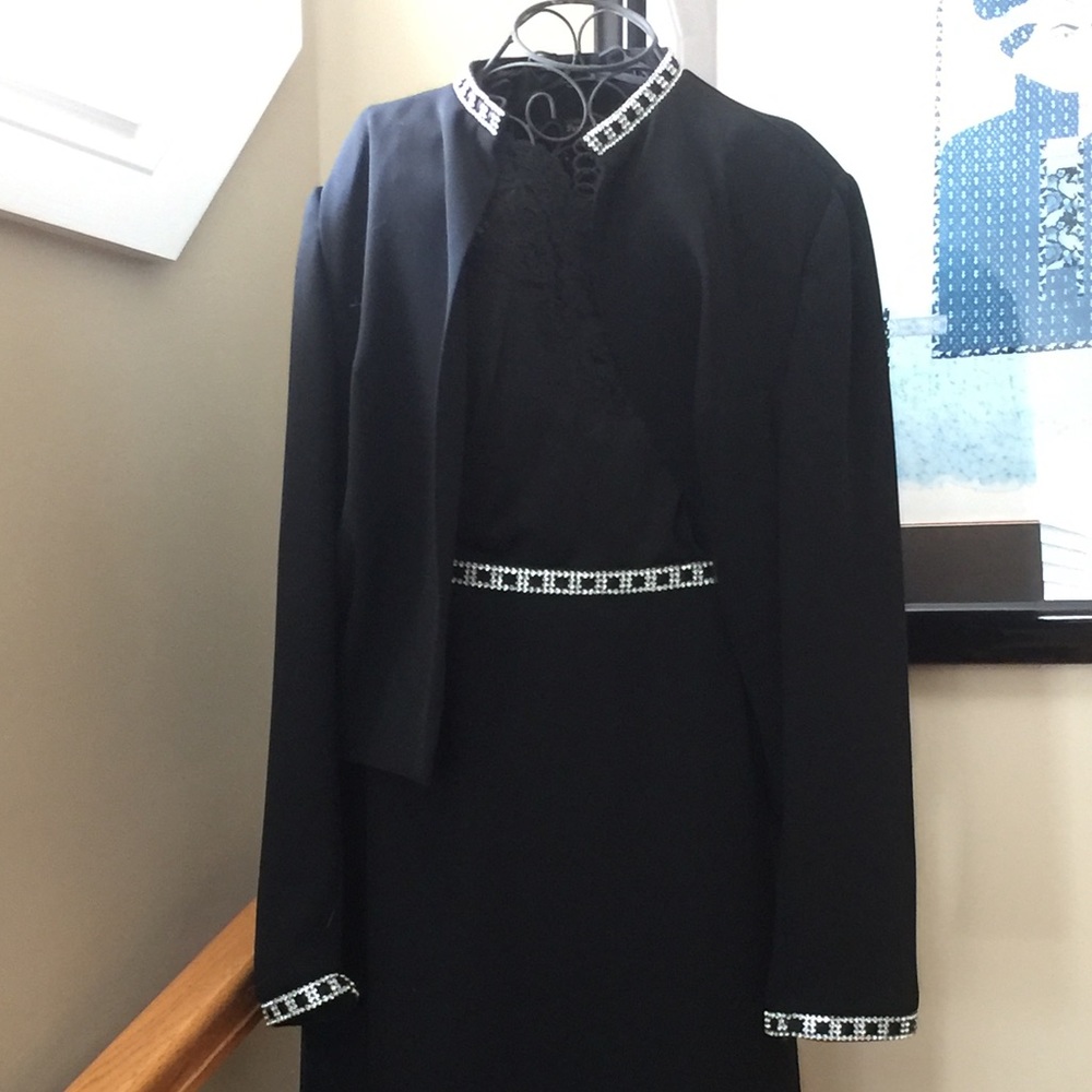 2 piece black skirt and jacket with rhinestones.